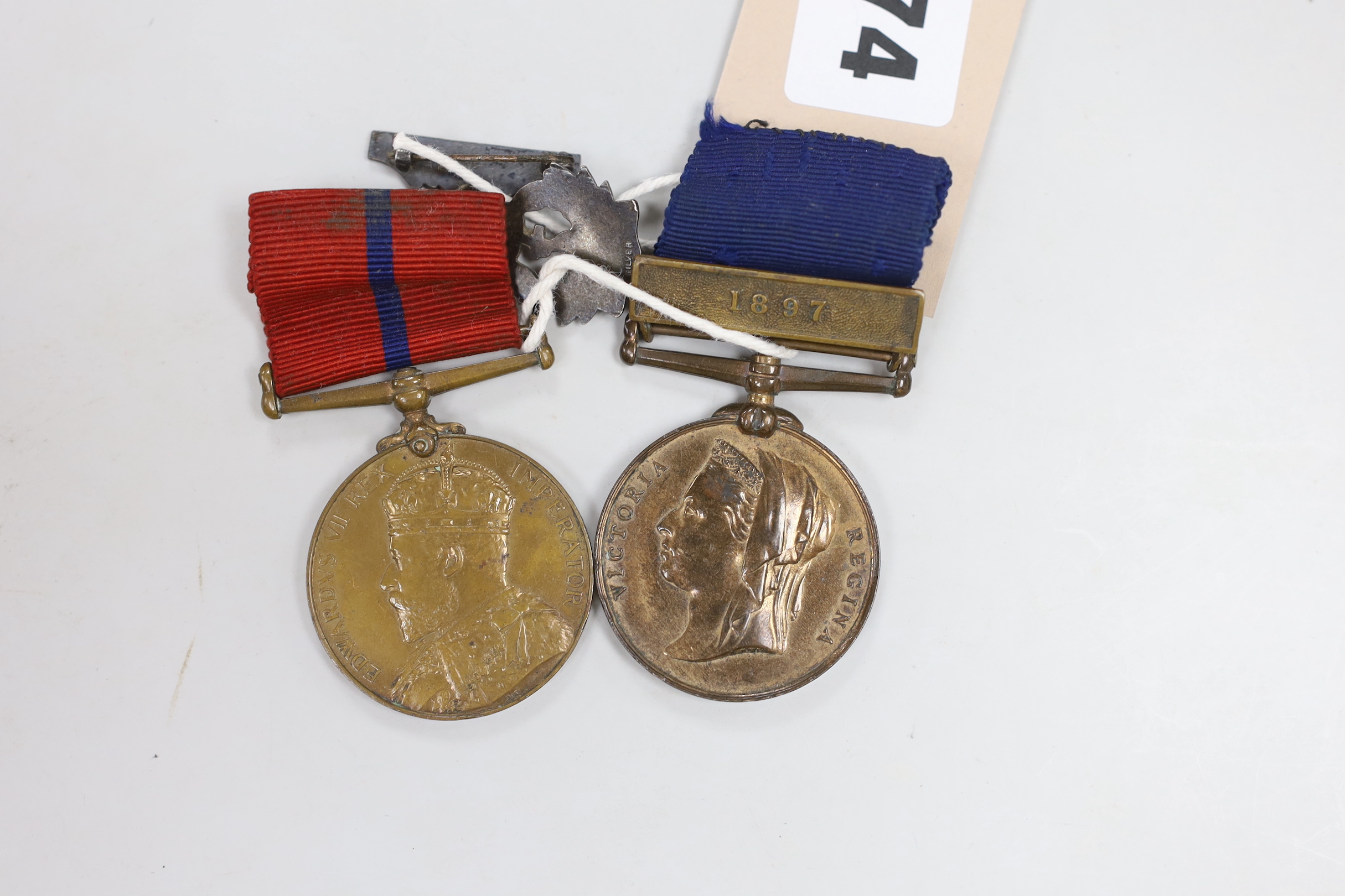 A Metropolitan Police medal, Jubilee 1887 with 1897 clasp named to PC. N. Symonds, D-Division, and Metropolitan Police medal, Coronation Edward VII 1902, named to PS N. Simmonds, A Division, together with a silver and en